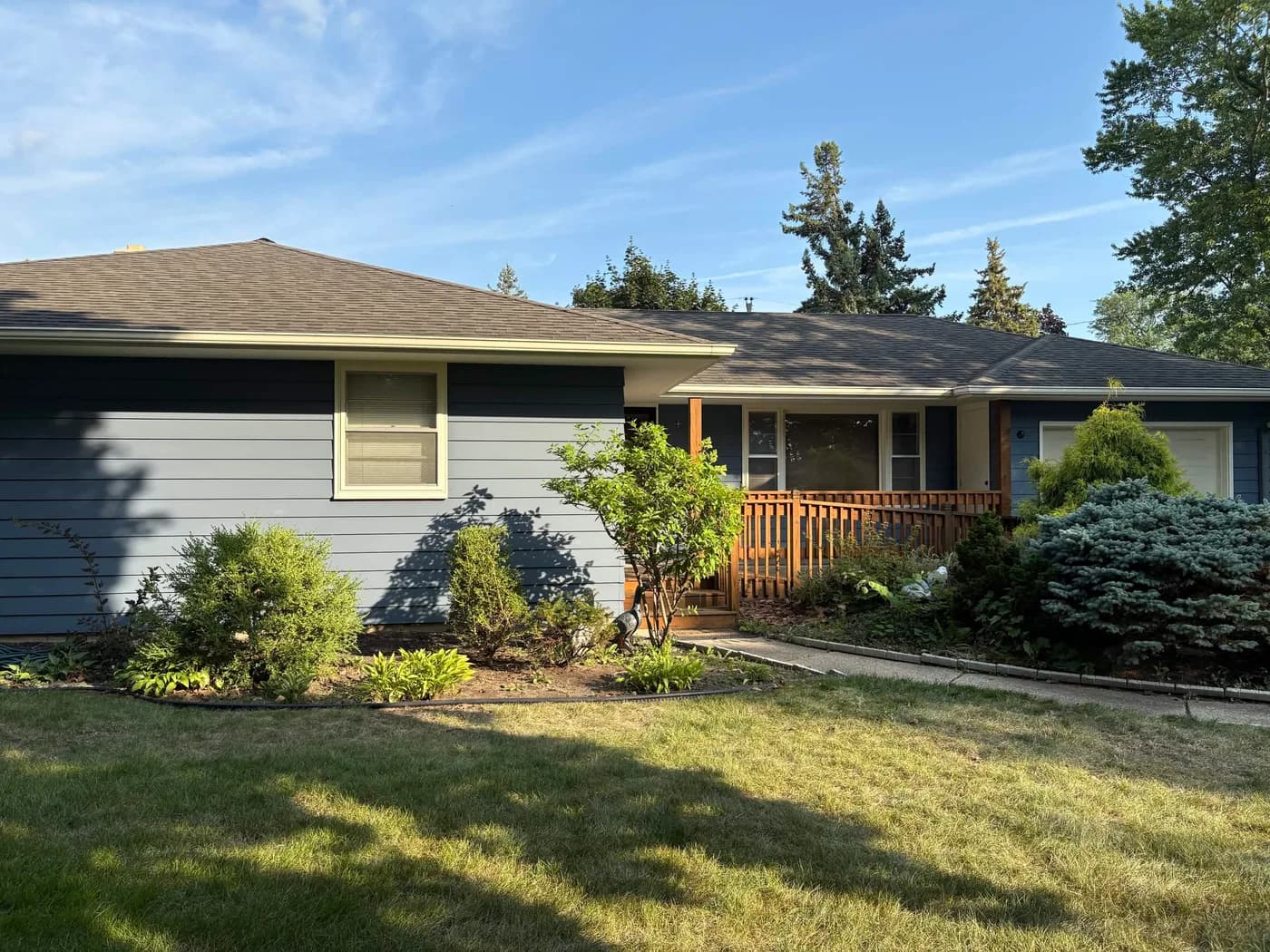 Pete's Rockford home after repainting, with Sherwin-Williams Granite Peak siding and Morning Sun trim
