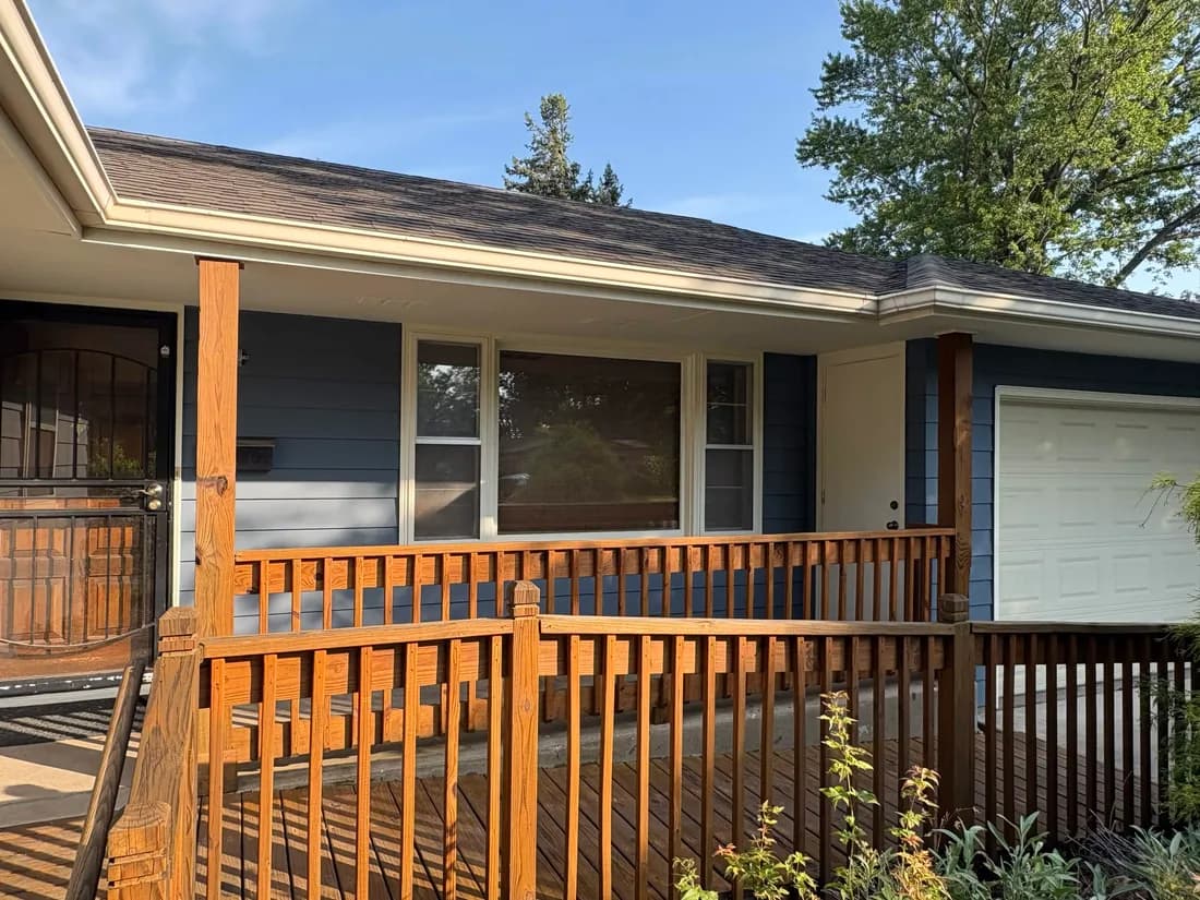 Freshly painted ranch exterior with crisp trim and a newly stained front deck