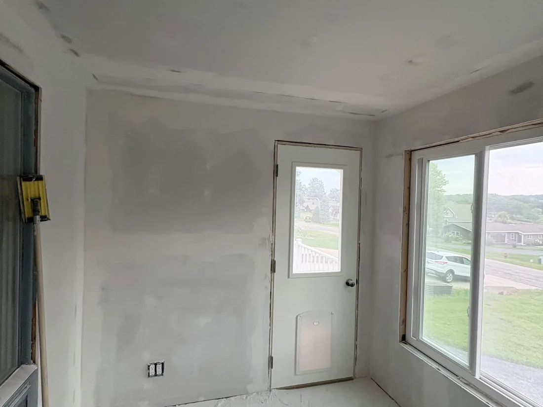 Four seasons room with the drywall taped, finished and ready for paint